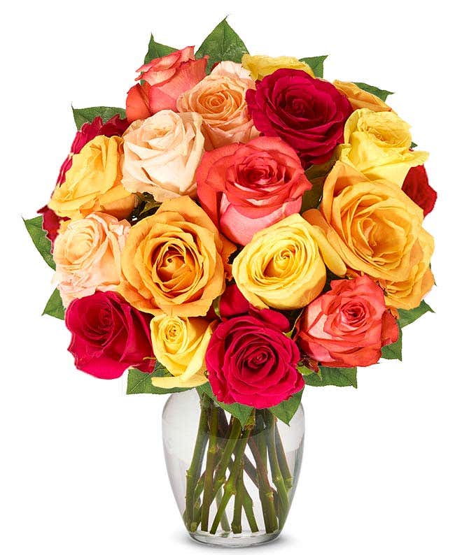  A stunning arrangement featuring one and a half dozen fall roses in vibrant autumn colors.